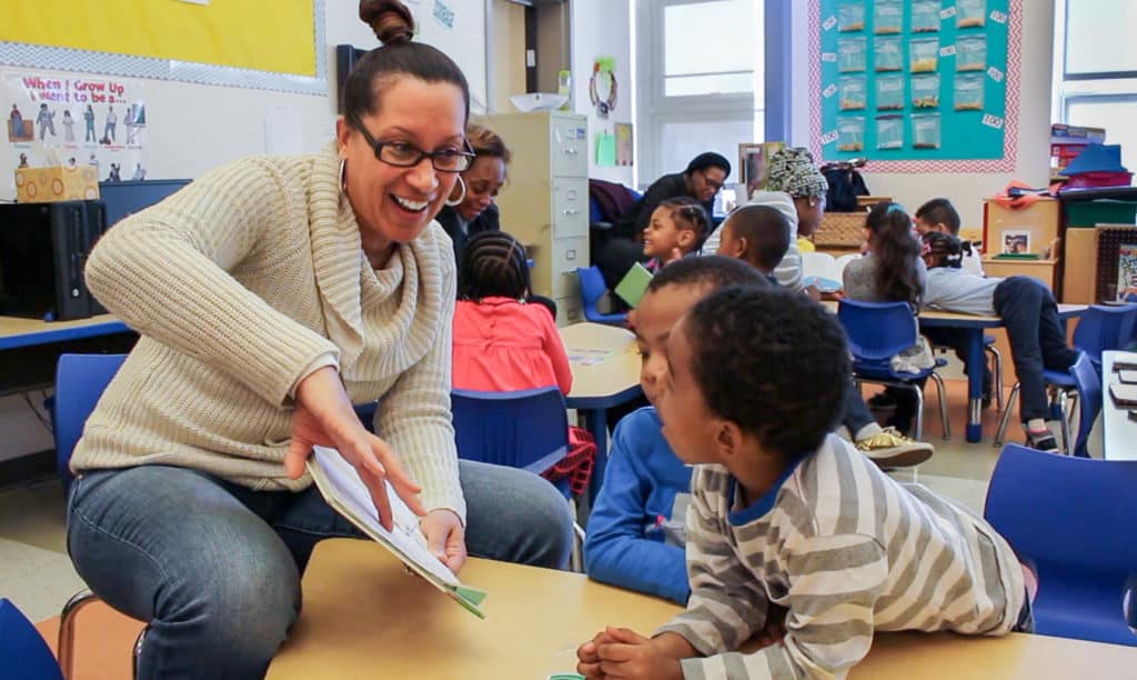 AB reading to scholars